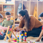 femaled kindergarten teacher with students